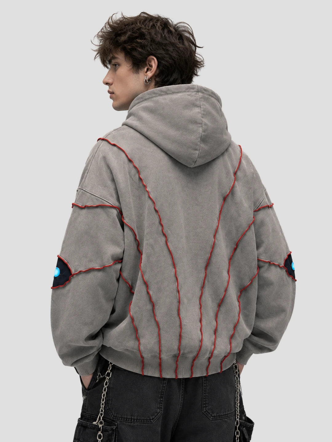 None Unit Abyss Eye Embroidered Hoodie in gray male model back view
