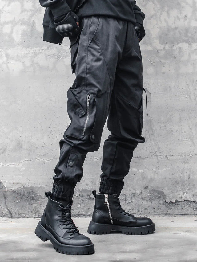 None Unit black strap cargo jogger pants zip pocket and cuff detail