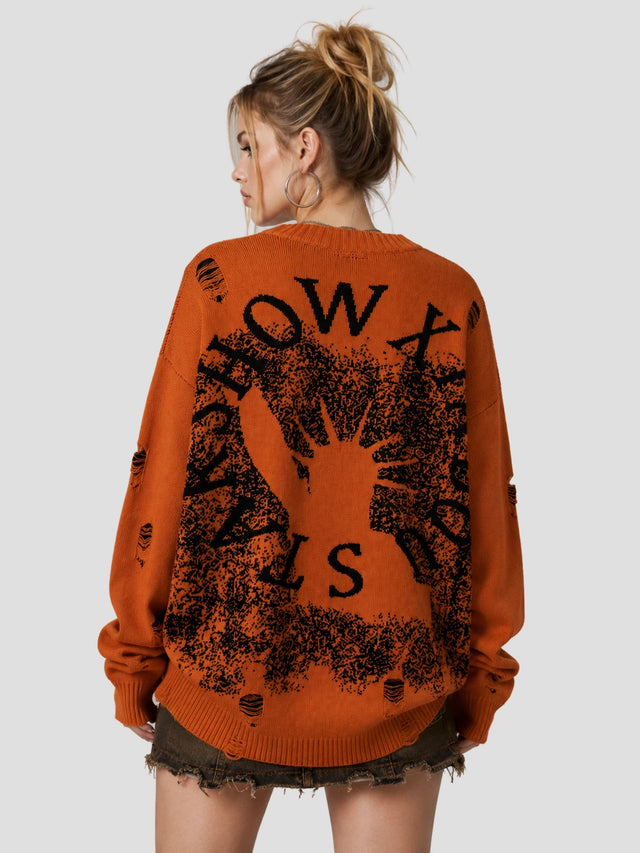 None Unit Liberty Hand Distressed Graphic Sweater in orange female model back view
