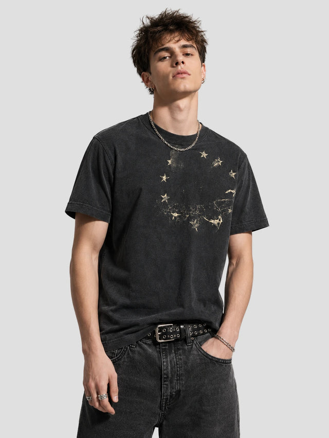 None Unit Star Relic Washed Graphic Tee in washed black model front view