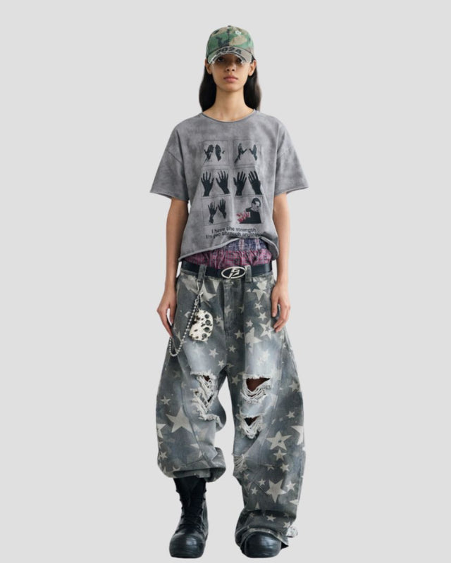 STAR-PATTERN DISTRESSED CURVED PANTS