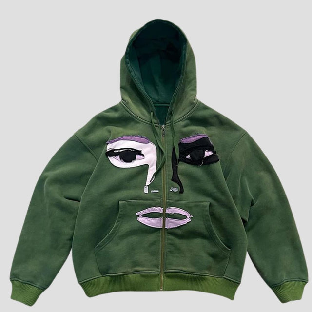 Sudadera con capucha y cremallera con diseño de patchwork de personajes