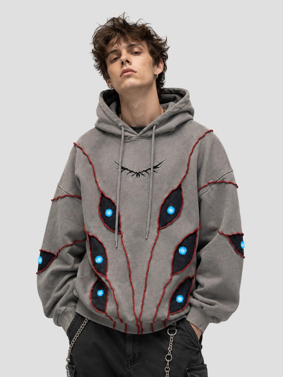 None Unit Abyss Eye Embroidered Hoodie in gray male model front view