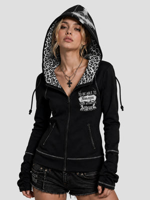 None Unit Leopard Cross Reversible Zip Hoodie in black female model hood-up view