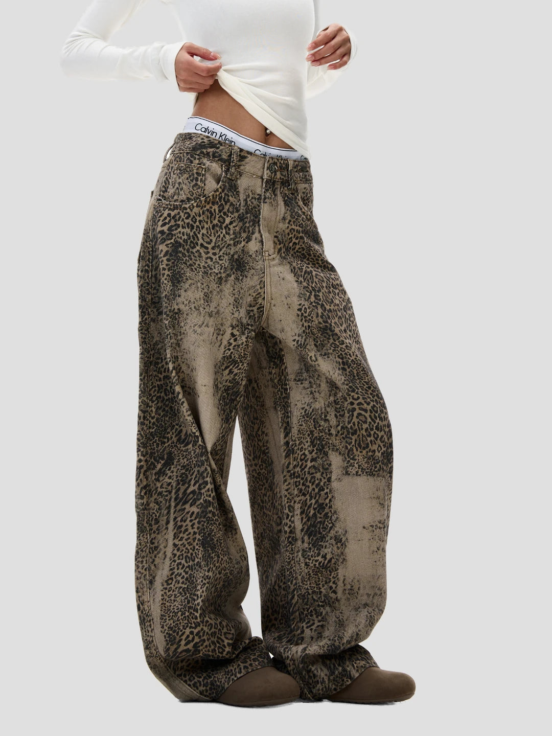 None Unit Leopard Wash Barrel Jeans in brown female model side view