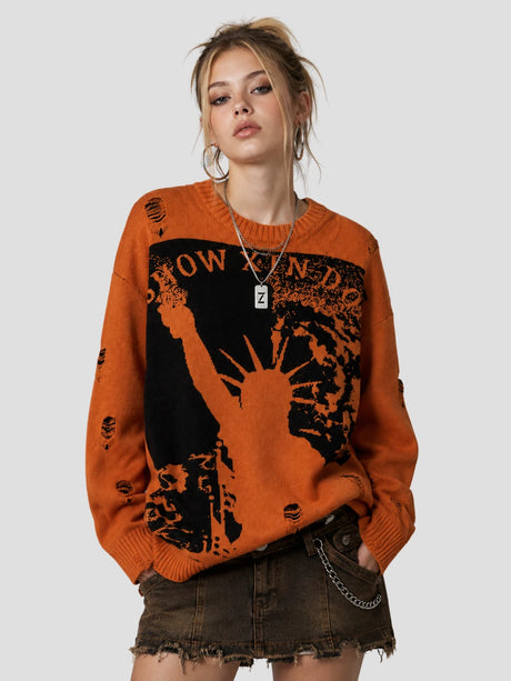 None Unit Liberty Hand Distressed Graphic Sweater in orange female model front view
