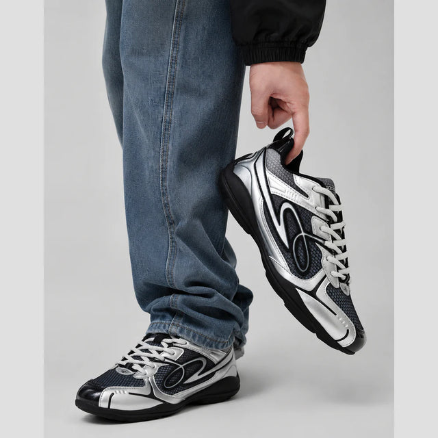None Unit Meteor Wave Low Sneaker in meteor silver handheld styling view