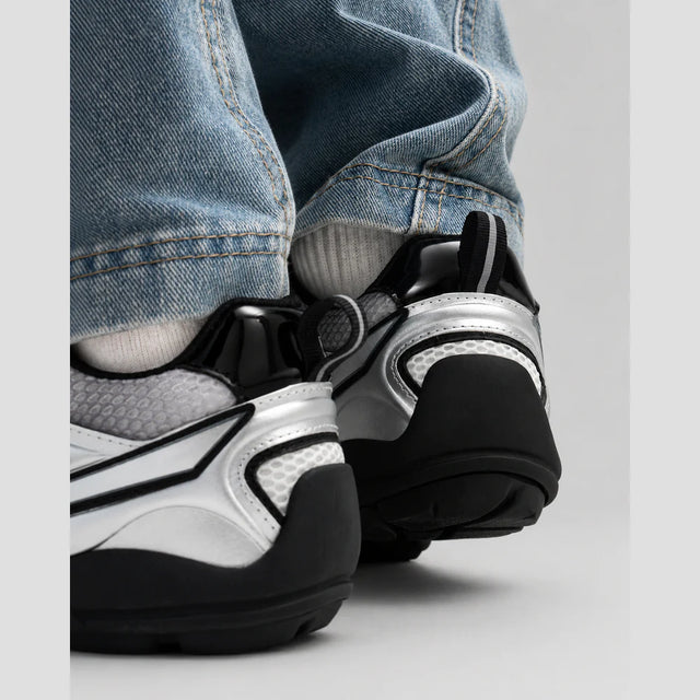 None Unit Meteor Wave Low Sneaker in meteor silver heel detail