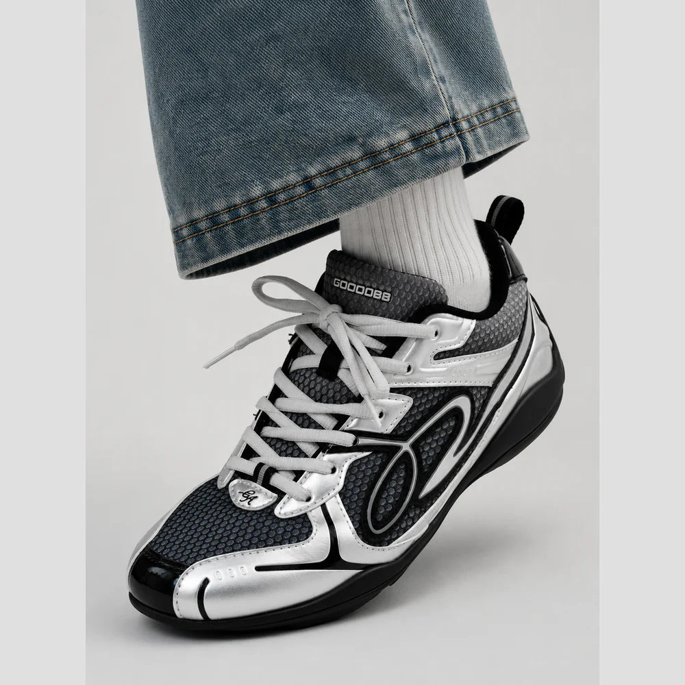 None Unit Meteor Wave Low Sneaker in meteor silver styled seated view