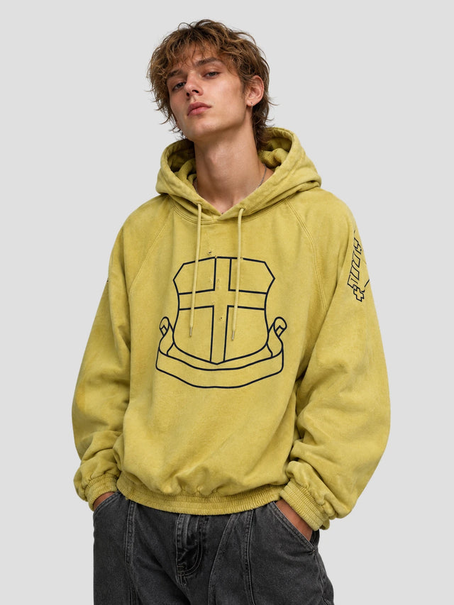 None Unit Yellow Shield Washed Hoodie in mustard yellow male model front view